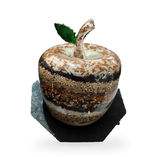 Imagen de Manzana de vidrio rellena de semillas